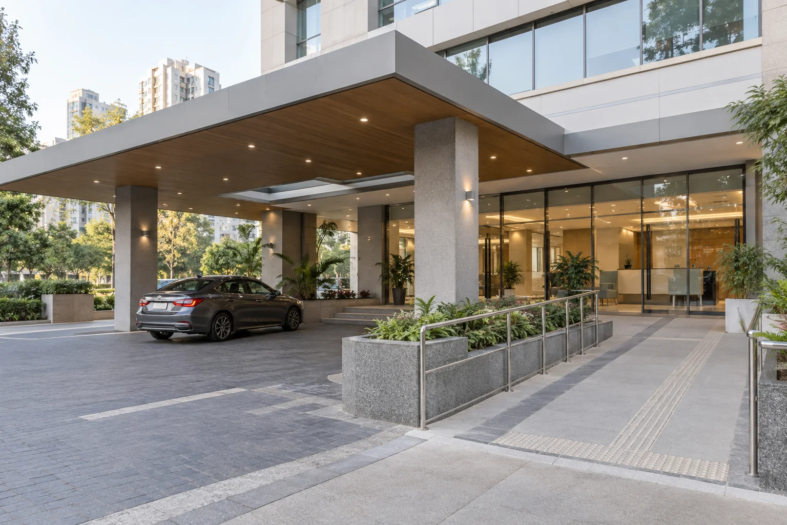 Illustrative hospital entrance with a covered dropoff area